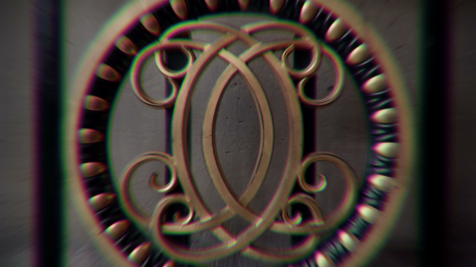 Probe-lens close-up of a clock bearing the Crillon monogram